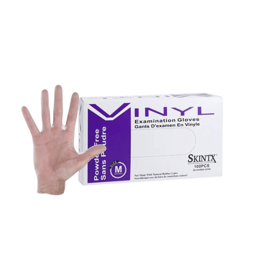 Box of SkinTx® powder free vinyl gloves, 100 count, and clear glove on hand